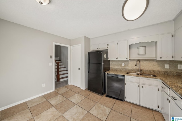 1056 Cardinal Cir, Hueytown, AL 35023 - kitchen featuring black appliances, a sink, white cabinetry, decorative backsplash, and a textured ceiling