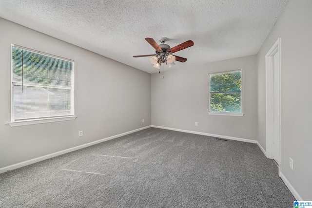 1056 Cardinal Cir, Hueytown, AL 35023 - empty room with ceiling fan, carpet flooring, baseboards, and a textured ceiling