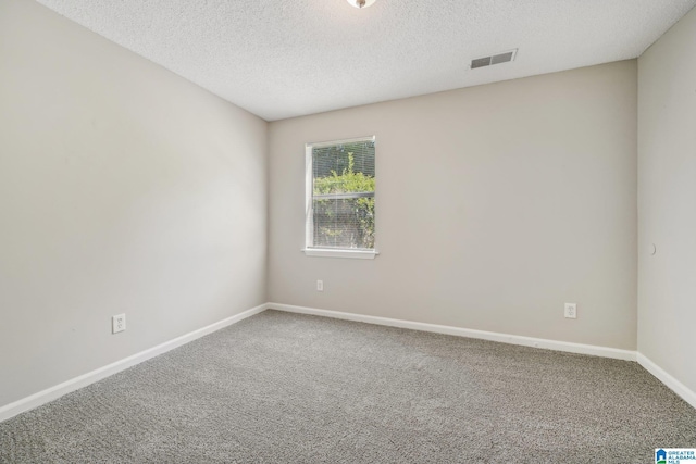 1056 Cardinal Cir, Hueytown, AL 35023 - carpeted spare room with a textured ceiling and baseboards