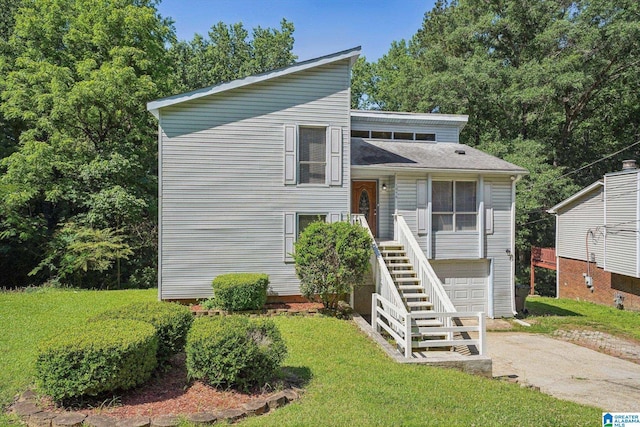 1056 Cardinal Cir, Hueytown, AL 35023 - tri-level home featuring driveway, a front lawn, and stairway