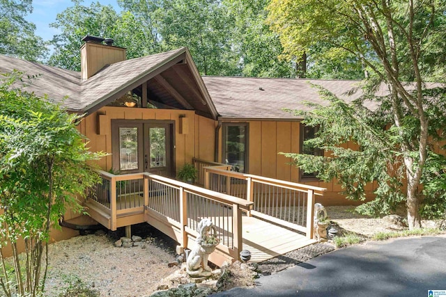 134 Highgate Hill Rd, Indian Springs Village, AL 35124 - rustic home with a shingled roof, a chimney, a wooden deck, french doors, and board and batten siding