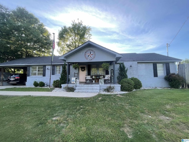 401 Studdard Dr, Clanton, AL 35045 - view of front of house featuring brick siding, covered porch, and a front lawn