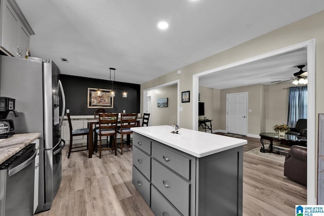 14 County Road 279, Cullman, AL 35057 - kitchen with gray cabinetry, stainless steel appliances, light wood-style flooring, and light countertops
