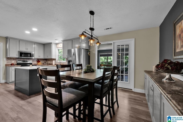 14 County Road 279, Cullman, AL 35057 - dining room featuring wood finished floors, a textured ceiling, recessed lighting, and baseboards