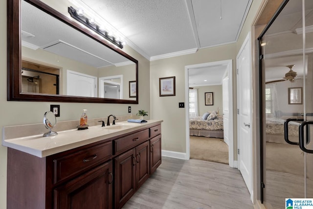 14 County Road 279, Cullman, AL 35057 - full bath with vanity, wood finished floors, ornamental molding, connected bathroom, and a shower stall
