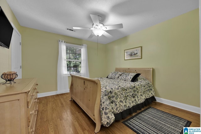 14 County Road 279, Cullman, AL 35057 - bedroom with baseboards, wood finished floors, and a ceiling fan