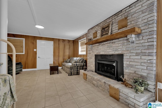 14 County Road 279, Cullman, AL 35057 - living area featuring tile patterned floors, wood walls, a brick fireplace, and baseboards