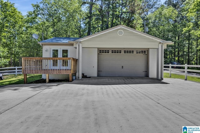 14 County Road 279, Cullman, AL 35057 - ranch-style home featuring an attached garage, brick siding, french doors, and view of wooded area
