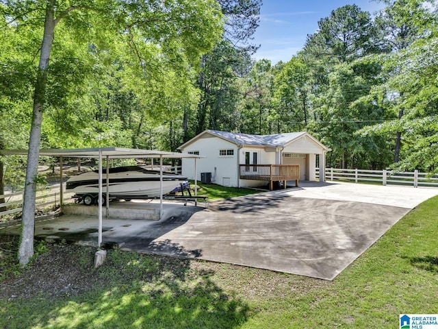 14 County Road 279, Cullman, AL 35057 - view of home's exterior with a carport, driveway, a garage, and central air condition unit