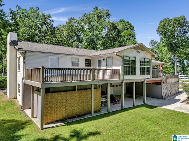 14 County Road 279, Cullman, AL 35057 - back of property featuring a yard, an attached garage, a patio, and a deck