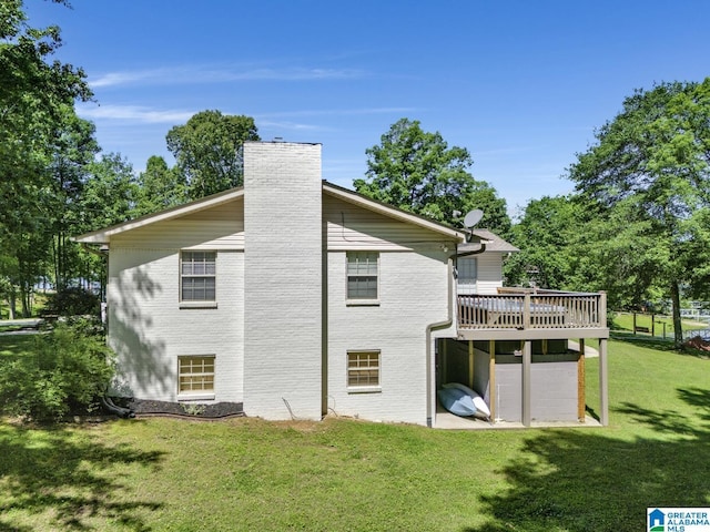 14 County Road 279, Cullman, AL 35057 - back of house featuring a deck, a chimney, a yard, and brick siding