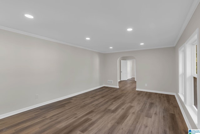 7300 6th Ave S, Birmingham, AL 35206 - spare room with arched walkways, dark wood-style floors, baseboards, crown molding, and recessed lighting