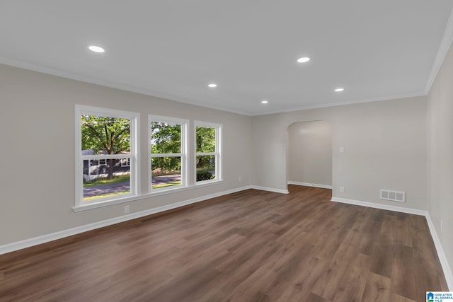 7300 6th Ave S, Birmingham, AL 35206 - empty room featuring arched walkways, ornamental molding, dark wood-style floors, baseboards, and recessed lighting