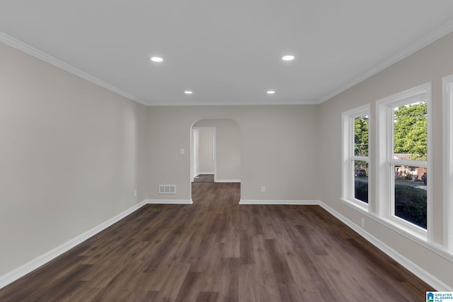 7300 6th Ave S, Birmingham, AL 35206 - spare room featuring arched walkways, dark wood-style flooring, recessed lighting, baseboards, and ornamental molding