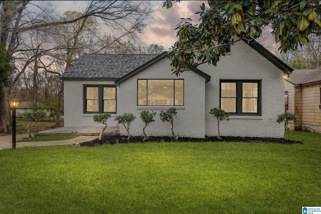 3010 15th St, Ensley, Birmingham, AL 35208 - view of front of house featuring brick siding, roof with shingles, and a front lawn