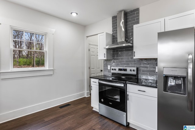 3010 15th St, Ensley, Birmingham, AL 35208 - kitchen featuring stainless steel appliances, wall chimney range hood, backsplash, dark wood-style flooring, and baseboards