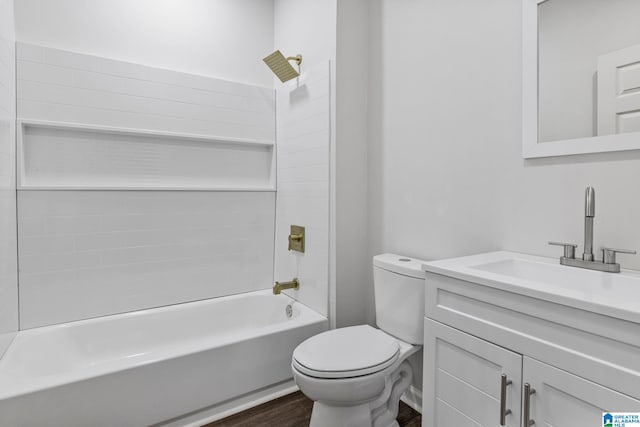 3010 15th St, Ensley, Birmingham, AL 35208 - full bathroom with wood finished floors, toilet, vanity, and shower / bathtub combination