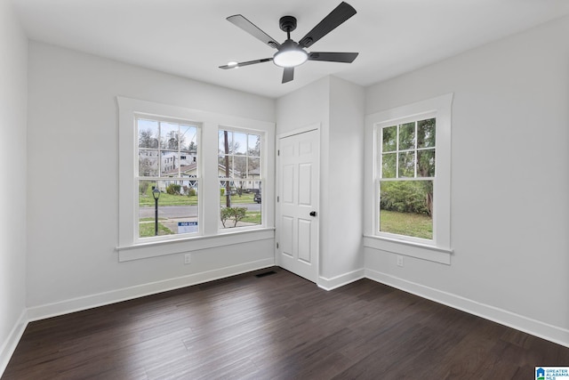3010 15th St, Ensley, Birmingham, AL 35208 - unfurnished room featuring dark wood-type flooring, baseboards, and a ceiling fan