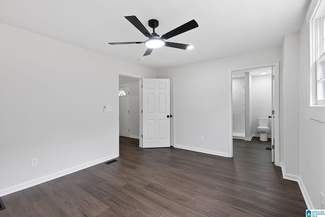 3010 15th St, Ensley, Birmingham, AL 35208 - unfurnished bedroom featuring dark wood finished floors, baseboards, ensuite bathroom, and a ceiling fan