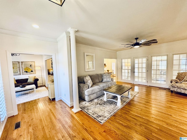 200 Quail Ridge Rd, Oneonta, AL 35121 - living area featuring ornate columns, light wood-type flooring, ceiling fan, plenty of natural light, and crown molding