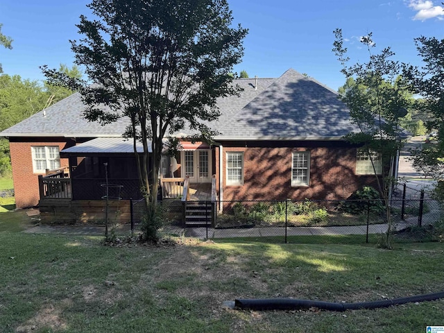200 Quail Ridge Rd, Oneonta, AL 35121 - back of property with a shingled roof, brick siding, a wooden deck, and a sunroom