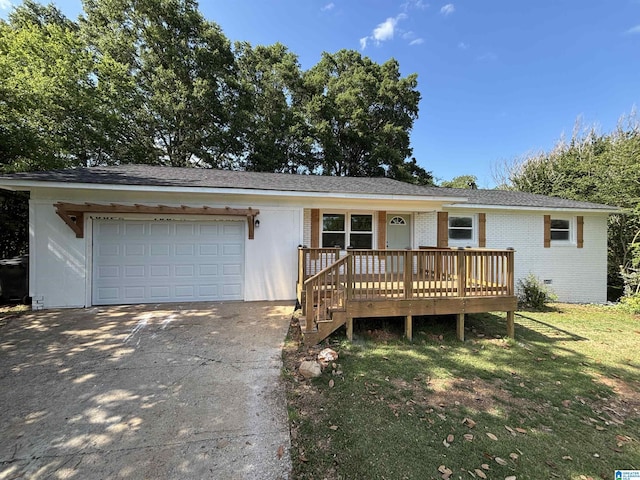 913 Alexandria Rd, Weaver, AL 36277 - ranch-style home with a garage, concrete driveway, brick siding, and a front lawn