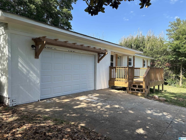 913 Alexandria Rd, Weaver, AL 36277 - ranch-style home featuring a garage, concrete driveway, and a wooden deck