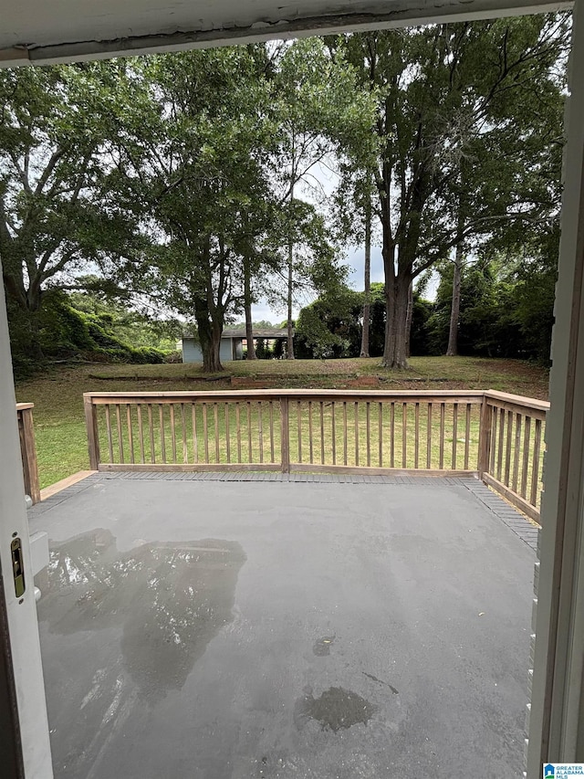 913 Alexandria Rd, Weaver, AL 36277 - wooden deck featuring a lawn