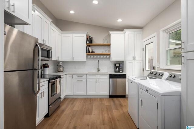 1345 Cresthill Rd, Birmingham, AL 35213 - kitchen featuring stainless steel appliances, washer and clothes dryer, a sink, white cabinets, and recessed lighting
