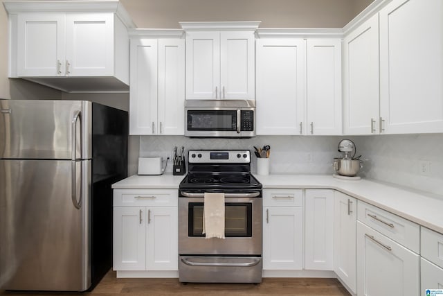1345 Cresthill Rd, Birmingham, AL 35213 - kitchen with stainless steel appliances, light countertops, and white cabinets