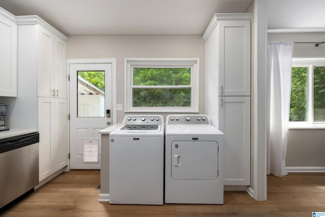 1345 Cresthill Rd, Birmingham, AL 35213 - laundry area with washing machine and clothes dryer, plenty of natural light, and light wood-style flooring