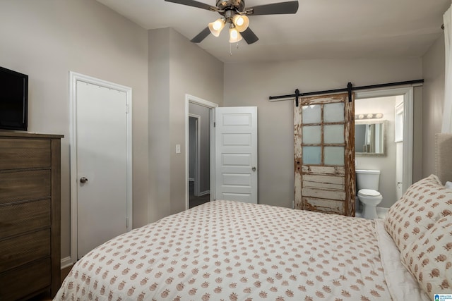 1345 Cresthill Rd, Birmingham, AL 35213 - bedroom with a barn door, ensuite bath, a ceiling fan, and vaulted ceiling