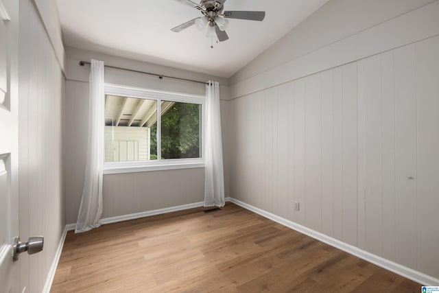 1345 Cresthill Rd, Birmingham, AL 35213 - unfurnished room featuring light wood-style flooring, lofted ceiling, a ceiling fan, and baseboards