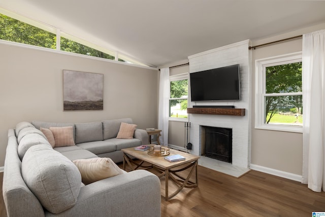 1345 Cresthill Rd, Birmingham, AL 35213 - living area with a fireplace, wood finished floors, baseboards, lofted ceiling, and plenty of natural light
