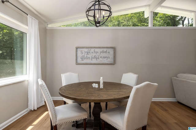 1345 Cresthill Rd, Birmingham, AL 35213 - dining space with wood finished floors, vaulted ceiling, a chandelier, and baseboards
