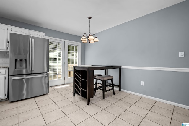 204 Forest Pkwy, Alabaster, AL 35007 - dining area with a chandelier, light tile patterned floors, and baseboards