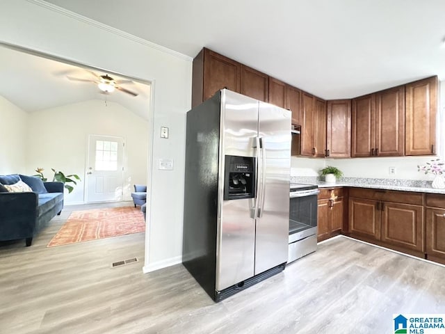 2723 6th St NE, Center Point, AL 35215 - kitchen featuring stainless steel appliances, light wood finished floors, light countertops, open floor plan, and baseboards