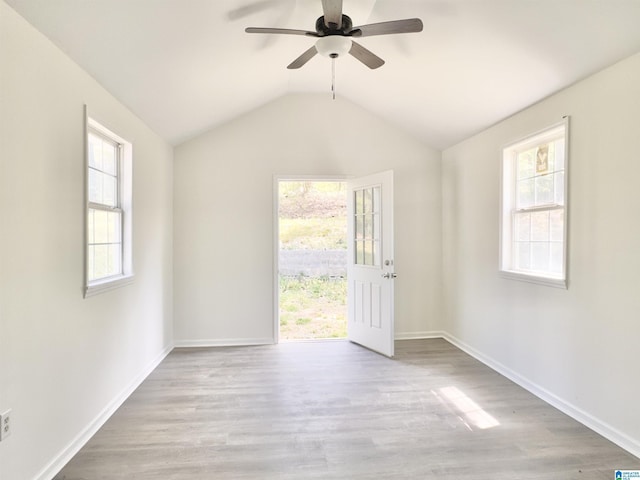 2723 6th St NE, Center Point, AL 35215 - empty room with wood finished floors, ceiling fan, baseboards, and vaulted ceiling