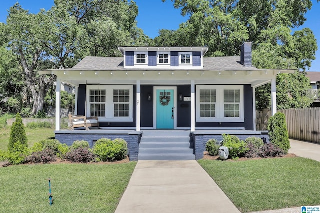 1505 36th St N, Birmingham, AL 35234 - bungalow-style house with covered porch, a chimney, and roof with shingles