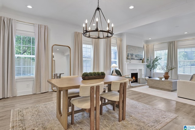 1505 36th St N, Birmingham, AL 35234 - dining room featuring a premium fireplace, light wood-style flooring, a chandelier, crown molding, and recessed lighting
