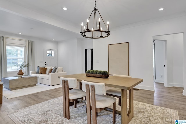 1505 36th St N, Birmingham, AL 35234 - dining room with light wood finished floors, a chandelier, recessed lighting, ornamental molding, and baseboards