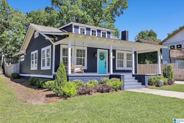 1505 36th St N, Birmingham, AL 35234 - bungalow-style home with covered porch and a chimney
