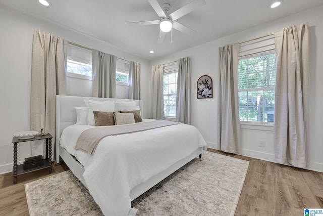 1505 36th St N, Birmingham, AL 35234 - bedroom with multiple windows, wood finished floors, baseboards, and recessed lighting