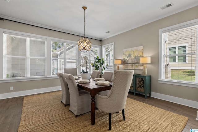 731 Rosebury Rd, Helena, AL 35080 - dining space with healthy amount of natural light, baseboards, wood finished floors, and ornamental molding