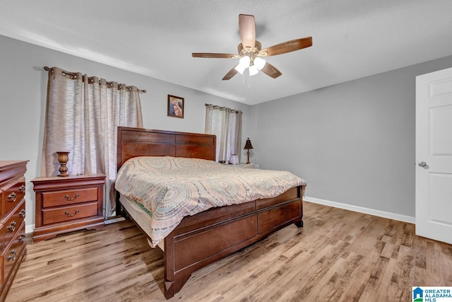 276 River Oak Trl, Hayden, AL 35079 - bedroom with light wood-type flooring, baseboards, and ceiling fan