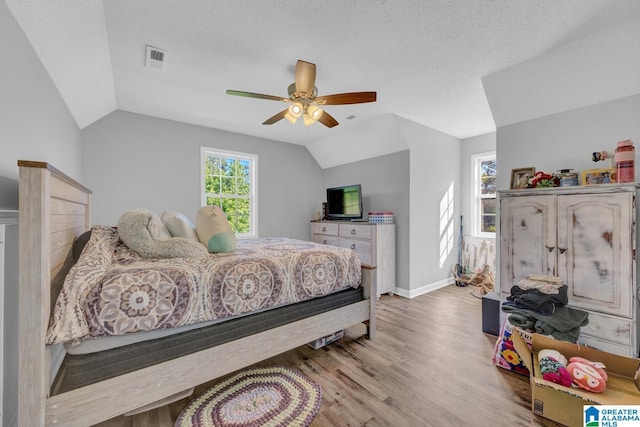 276 River Oak Trl, Hayden, AL 35079 - bedroom featuring lofted ceiling, light wood-style flooring, ceiling fan, and baseboards