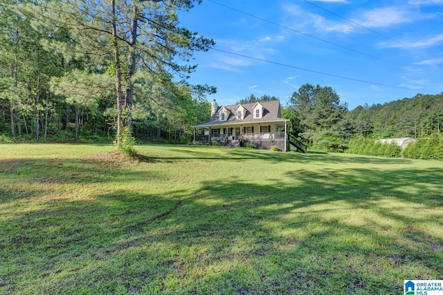 276 River Oak Trl, Hayden, AL 35079 - view of grassy yard with a porch and a view of trees