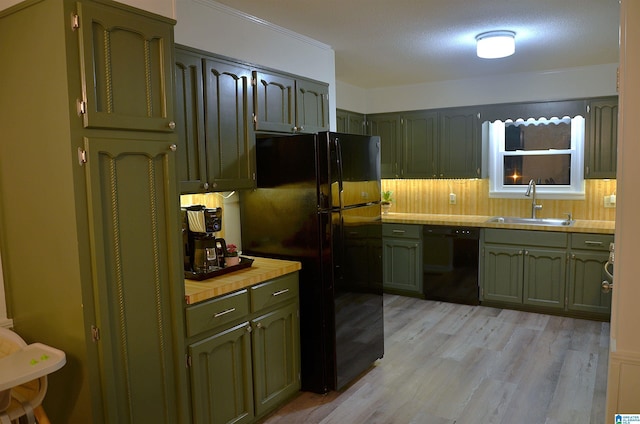 1679 Curry Hwy, Jasper, AL 35503 - kitchen featuring green cabinetry, black appliances, a sink, and light wood-type flooring