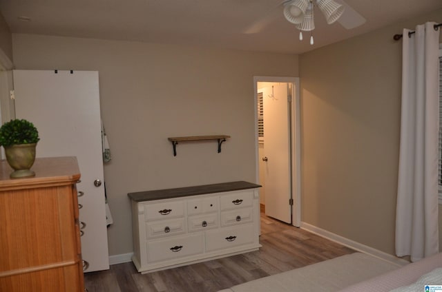 1679 Curry Hwy, Jasper, AL 35503 - bedroom with wood finished floors, baseboards, and ceiling fan