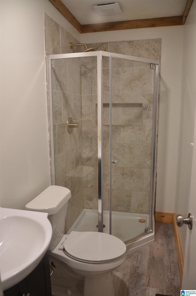 1679 Curry Hwy, Jasper, AL 35503 - full bath with toilet, a shower stall, a sink, and wood finished floors